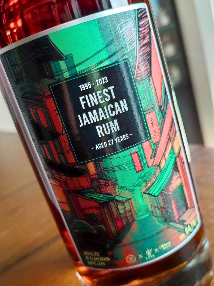 Bottle of Finest Jamaican Rum with a colorful label on a wooden surface